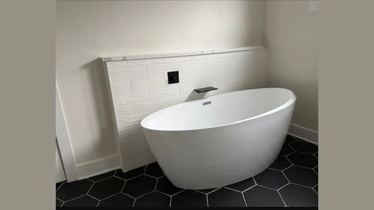 Bathroom remodel soaking bathtub and wall-mounted faucet installation in Milwaukee, Wisconsin